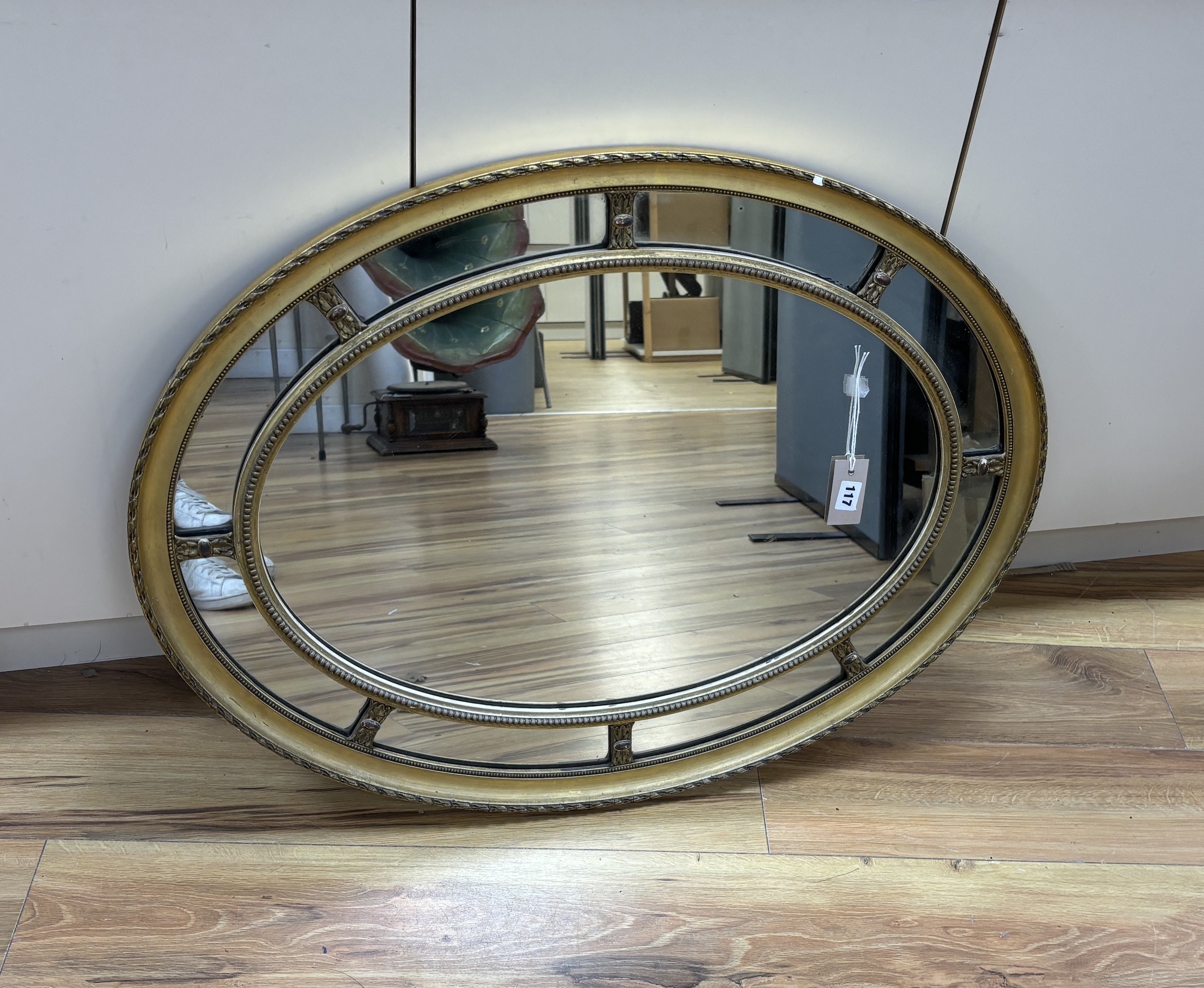 An oval marginal plate wall mirror, width 86cm, height 66cm